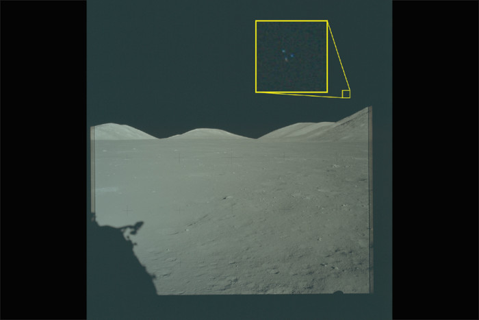 Archival imagery from the Apollo 17 mission to the Moon. The yellow box contains an enlarged area of the original photo in which three lights are visible above the lunar terrain.