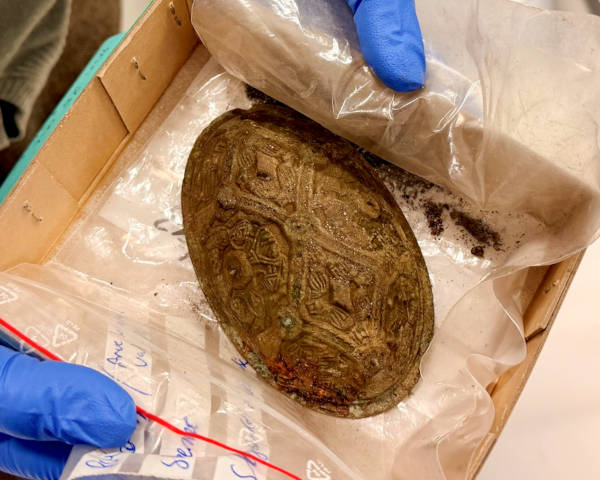 Brooch or buckle found in the grave.