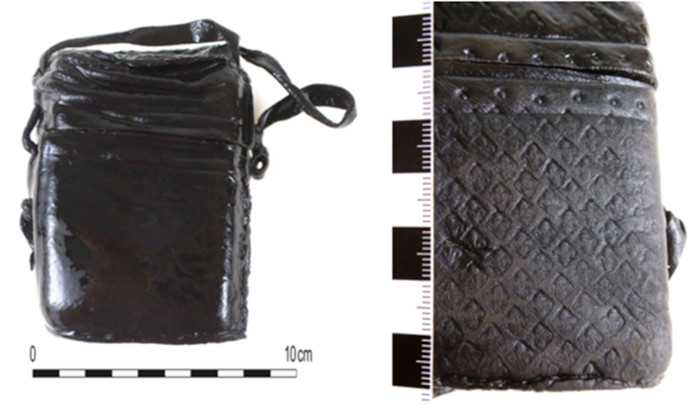 Leather binding in which the wax tablet book was found, with lily embossing