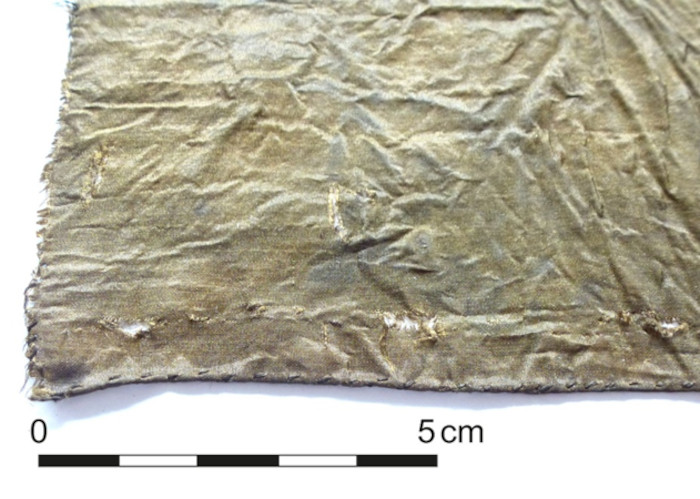 Close up of one of the high-quality fabric remnants also found in the latrine