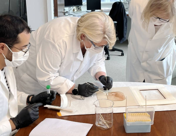 Forensic biologist Rhonda Roby (center) swabs&nbsp;Holy Child