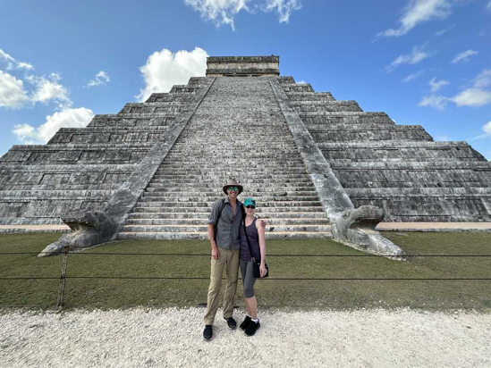 The author and his sister Jennifer Stephenson in front of the Maya Pyramid of the Feathered Serpent at Chichén Itzá,