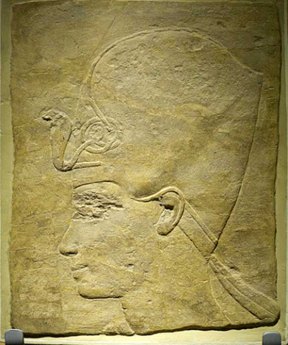 A sandstone portrait of King Tutankhamun wearing the khepresh or Blue (War) Crown. Rijksmuseum van Oudheden, Leiden.
