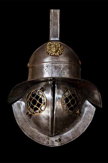 Murmillo gladiator helmet.  The murmillo was a type of gladiator during the Roman Imperial age.  The helmet of the murmillo had a broad brim, as well as a crest, which was adorned with plumes or horsehair. This crest would typically have a stylized fish on it, as the murmillo is sometimes referred to as the ‘fishman’. (WH_Pics / Adobe Stock)