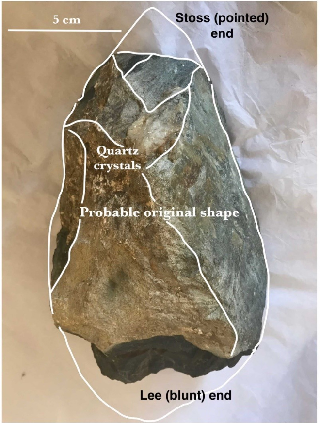 The proposed original shape of the boulder, along with its natural facets before human damage