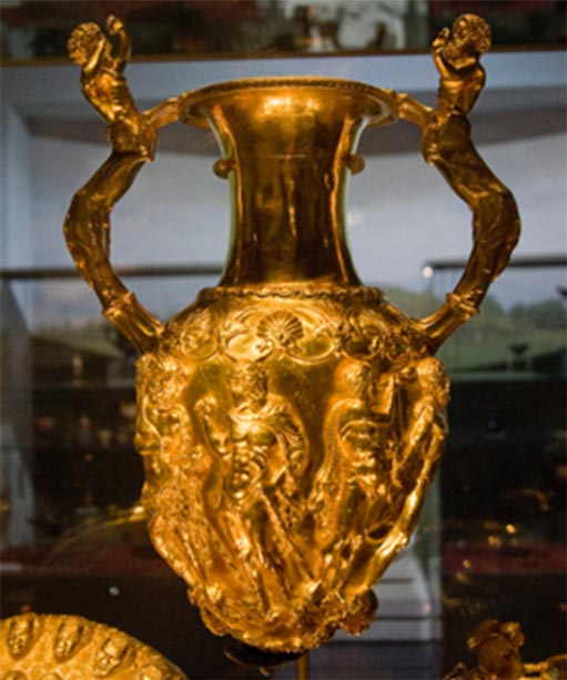 The Panagyurishte Treasure’s golden rhytonized amphora. The big amphora has handles shaped as centaurs, and the openings for pouring wine represent African heads. In between those two openings, the amphora is decorated with a scene of Hercules fighting a snake. (Ann Wuyts / CC BY 2.0)