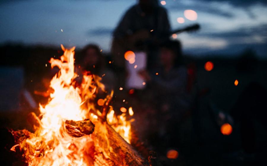 Christian group burns ‘satanic objects’ in bonfire. Credit: Andris / Adobe Stock