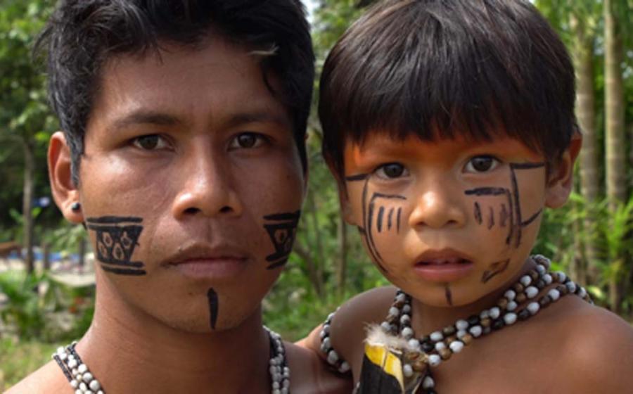 Indigenous father and son of the Amazon. Credit: gustavofrazao / Adobe Stock