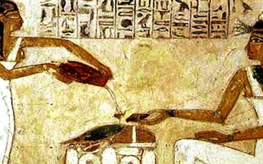 Egyptian hieroglyphics depict the pouring out of beer.