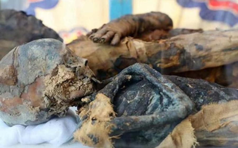 The mummified remains of the woman and boy found in the tomb. Credit: Ministry of Antiquities