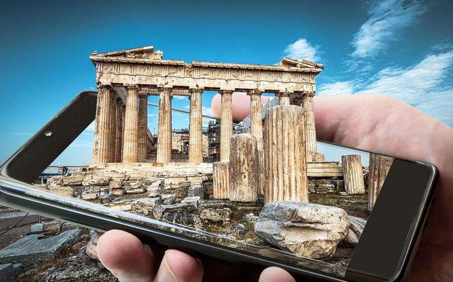 Ancient Greek science and technology represented by a 3D image of Athens landmark the Parthenon emerging from a smartphone screen.		Source: scaliger