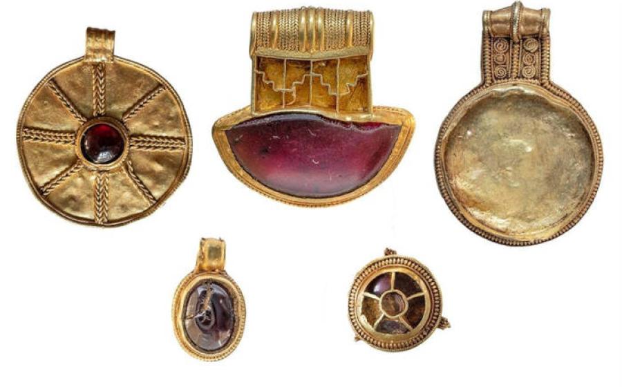 Four gold pendants and a gold-and-garnet brooch from the seventh century discovered in Lincolnshire, England