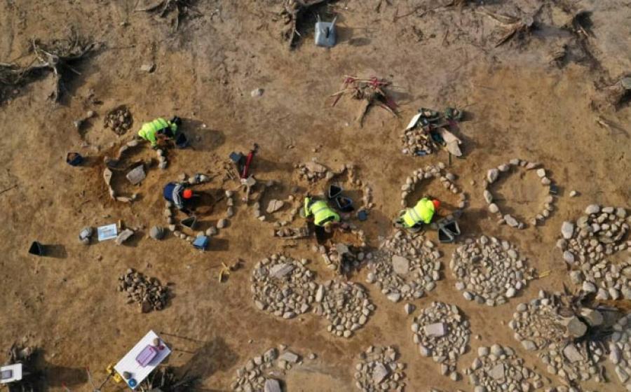 Archaeologists at work in a large burial field in southeastern Norway, where 40 circular stone formations with cremated bone remains, mostly from children, were found placed in the middle.		Source: Museum of Cultural History/Science Norway