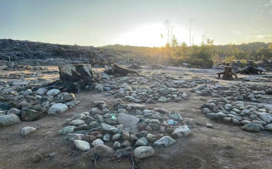Archaeologists at work in a large burial field in southeastern Norway, where 40 circular stone formations with cremated bone remains, mostly from children, were found.	Source: Guro Fossum/Museum of Cultural History/ University of Oslo