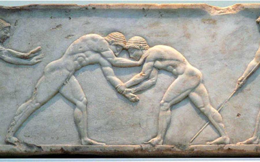 Ancient bas-relief on grave stele in Kerameikos in Athens, Greece depicting two wrestlers in action.	Source: National Archaeological Museum of Athens/ CC BY-SA 2.0 DE