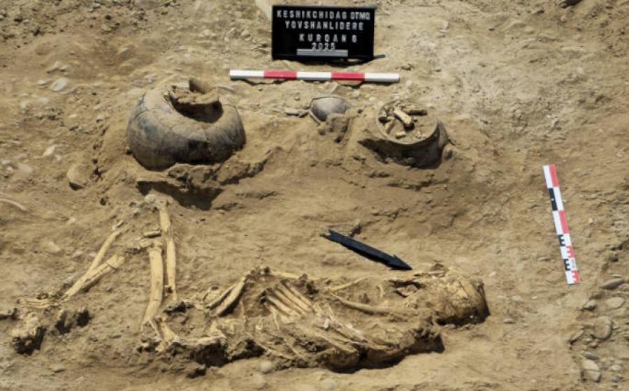 The skeletal remains of the burial with associated grave goods. 