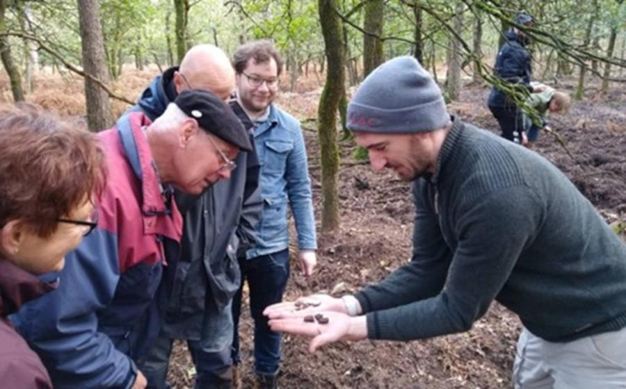 Dr Wouter Verschoof-van der Vaart with volunteers at one of the burial mounds identified during the project.