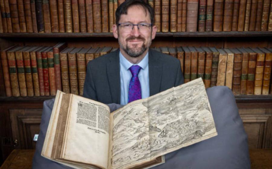 Nathan MacDonald with the Bible map in Trinity College's Wren Library