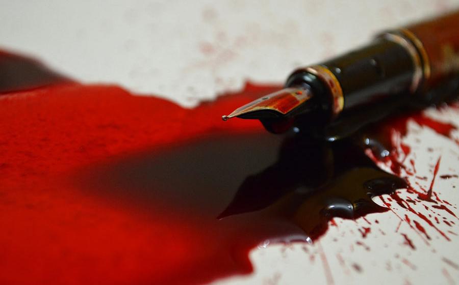 Pen with blood ink. Source: VJP / Adobe Stock