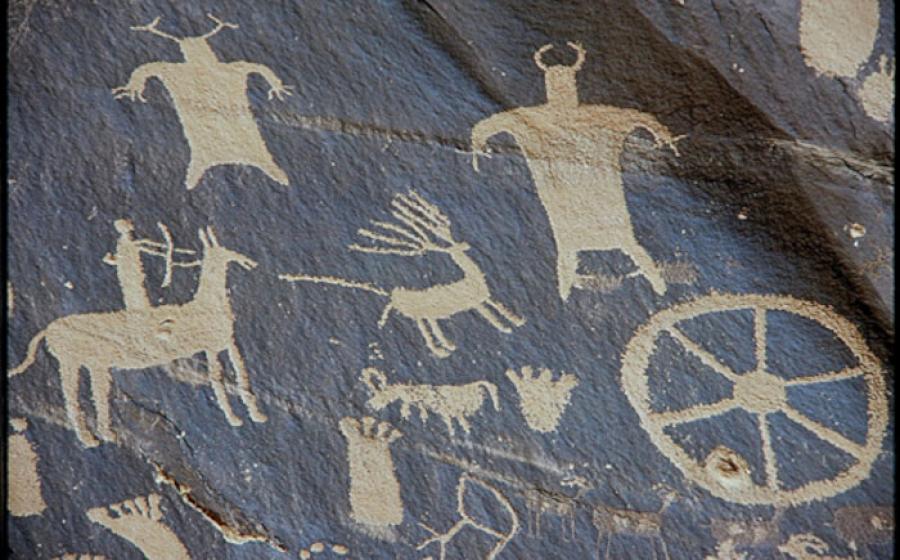A petroglyph from Newspaper Rock, Utah, showing hunting with a bow and arrow.