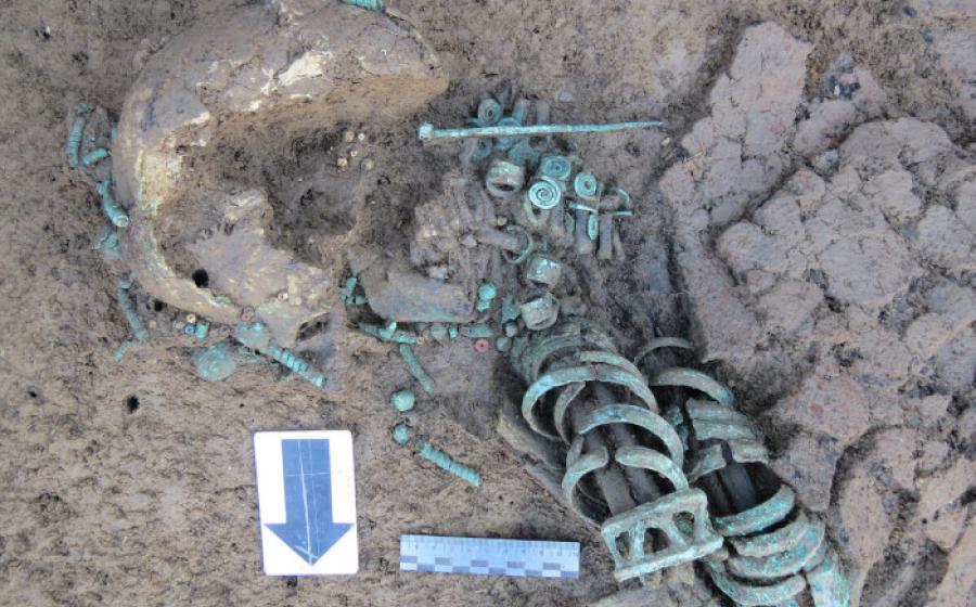 The striking remains of the woman buried with 19 bronze bracelets and 8 rings on her hands