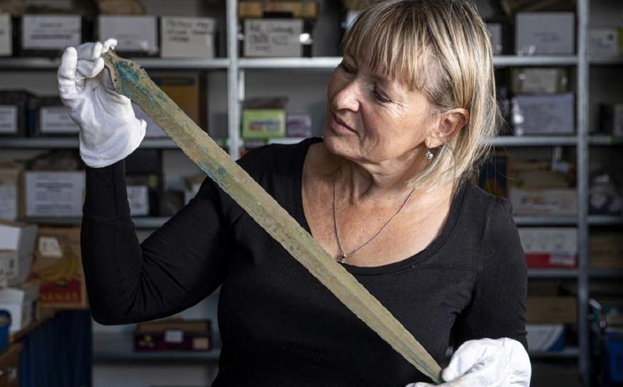 Martina Bekova of the Rychnov Museum with the Bronze age sword.             Source: David Tanecek, CTK