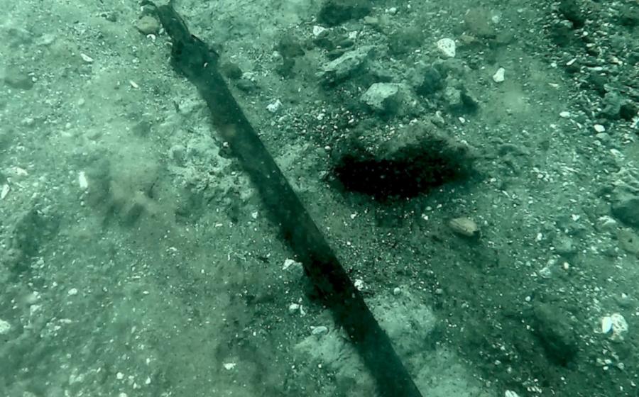 The 3,000-year-old bronze sword where it lay on the bed of Lake Mezzano 