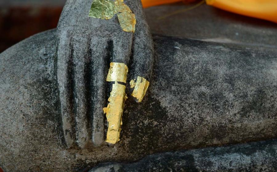 Buddha’s finger became a sacred relic of healing and well-being in Buddhism faith.  Statue Source: Natthapong/Adobe Stock