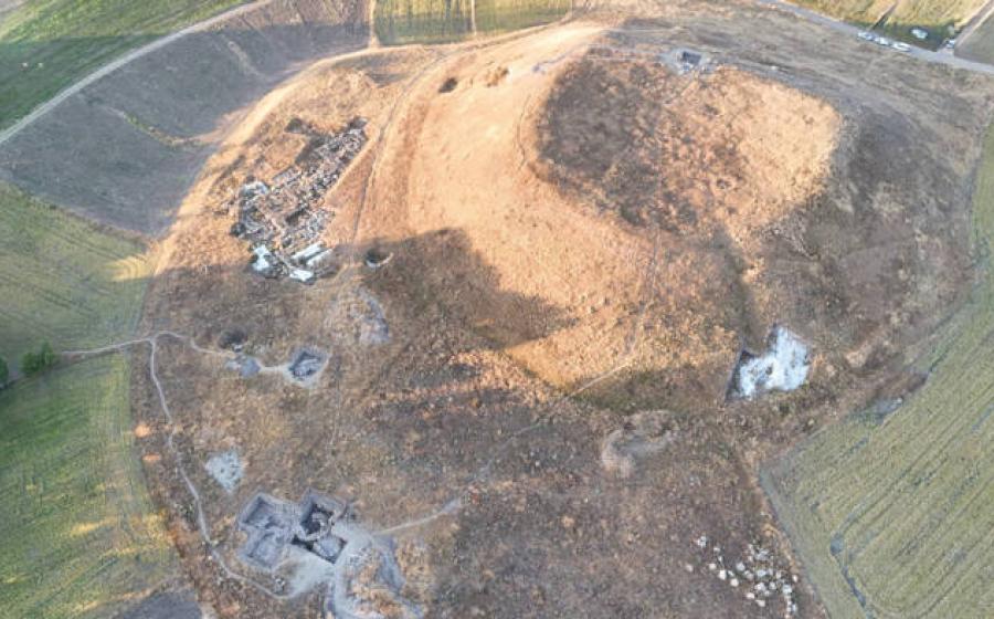 Aerial view of Uşaklı Höyük archaeological excavation showing large mound
