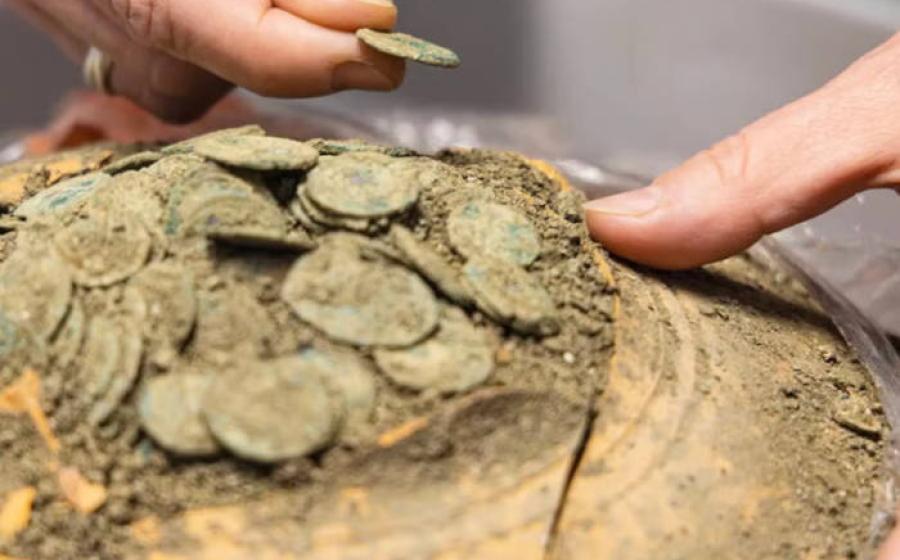 Vessel of Roman coins found in France.