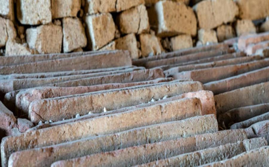 A detail of the neatly aligned ceramic roof tiles and tuff blocks in a newly excavated site in Pompeii