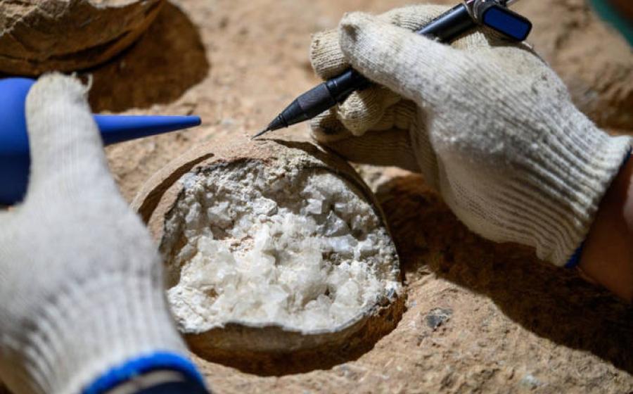 Scientist dissecting one of the Yunyang dinosaur eggs