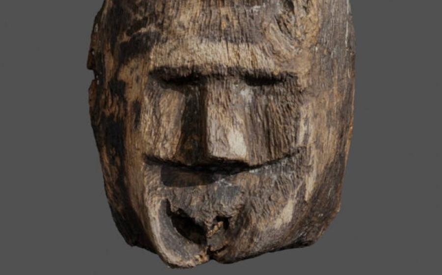 Carved wooden face discovered in Lake Lednica, Poland