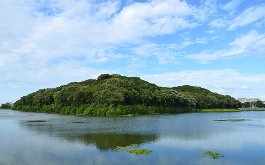 Forested Kofun burial mound surrounded by a moat