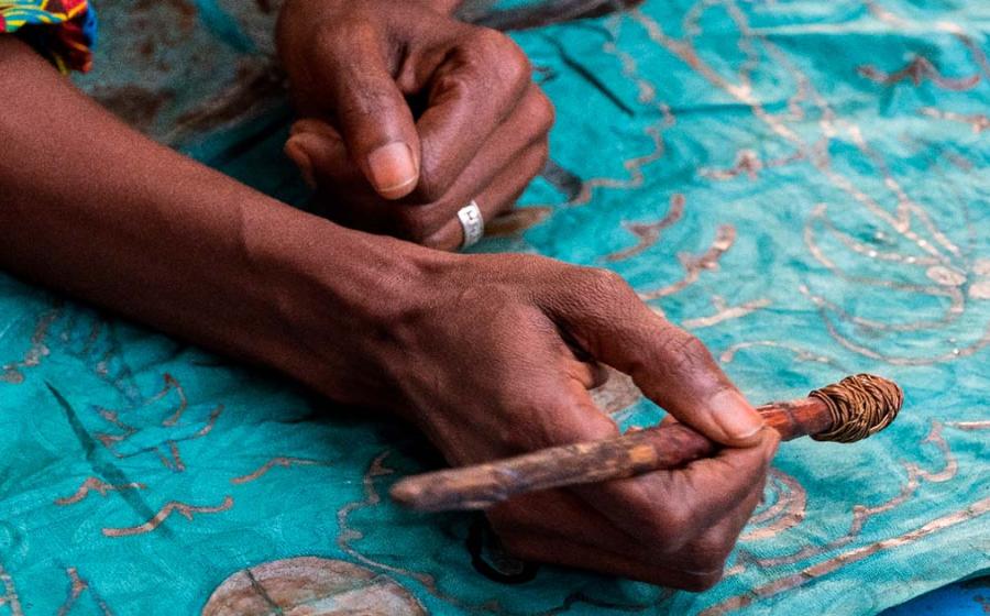 Decorating fabric in Gambia. Source:  s-aznar / Adobe Stock.