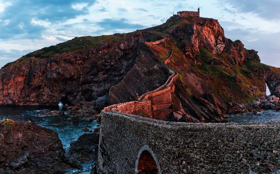 Sunrise on the San Juan de Gaztelugatxe Island, Spain. Source: samael334/Adobe Stock