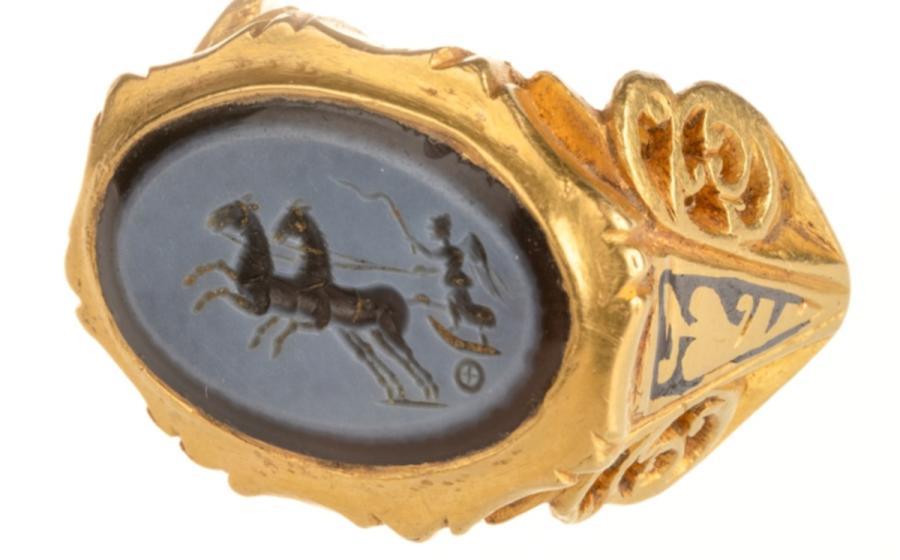 The Roman gold finger ring with a dark blue and light grey nicolo engraved gem depicting Victory
