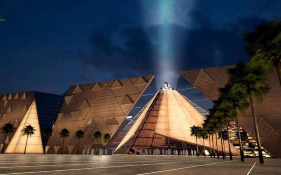 Exterior view of the Grand Egyptian Museum at night.