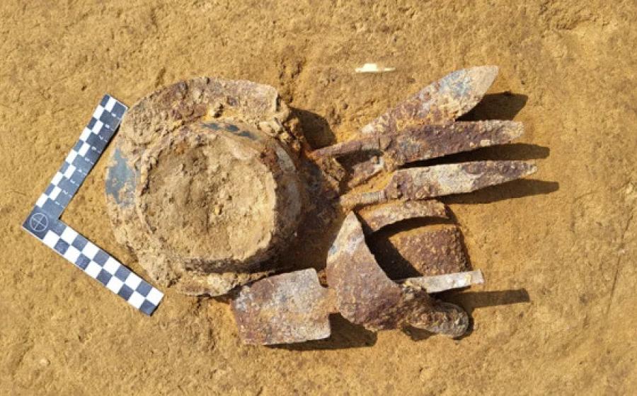 Equipment including bent sword, shears, and umbo from the center of a shield found at the Vandal cemetery.