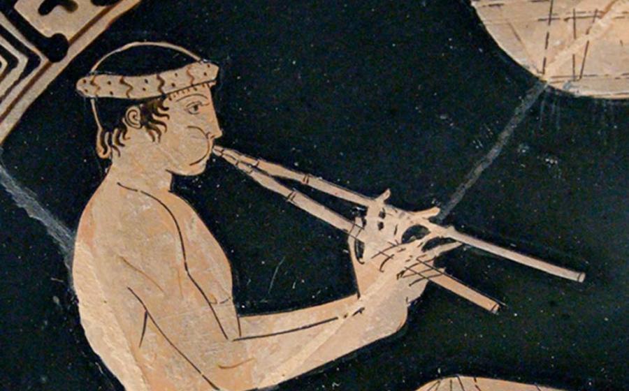Youth playing the aulos, detail of a banquet scene. Tondo of an Attic red-figure cup, ca. 460 BC–450 BC. 