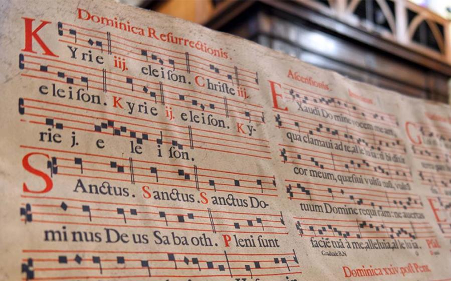 Book of Gregorian chants within a cathedral. Source: Ivan / Adobe Stock