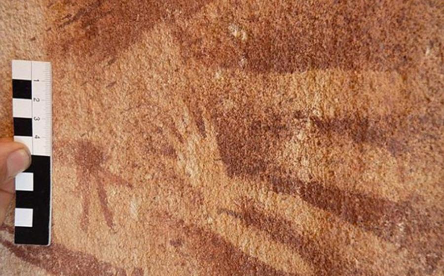 A tiny hand, originally assumed to be of a very young child or infant was stenciled inside the outline of an adult hand on the wall of the Wadi Sura II rock shelter about 8,000 years ago. New research suggests that the prints were actually made by reptiles.
