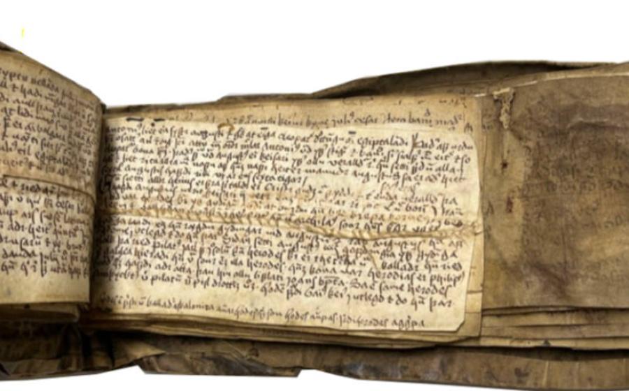 Icelandic literature written in Old Norse, but on recycled parchment where some Latin writing is still legible..