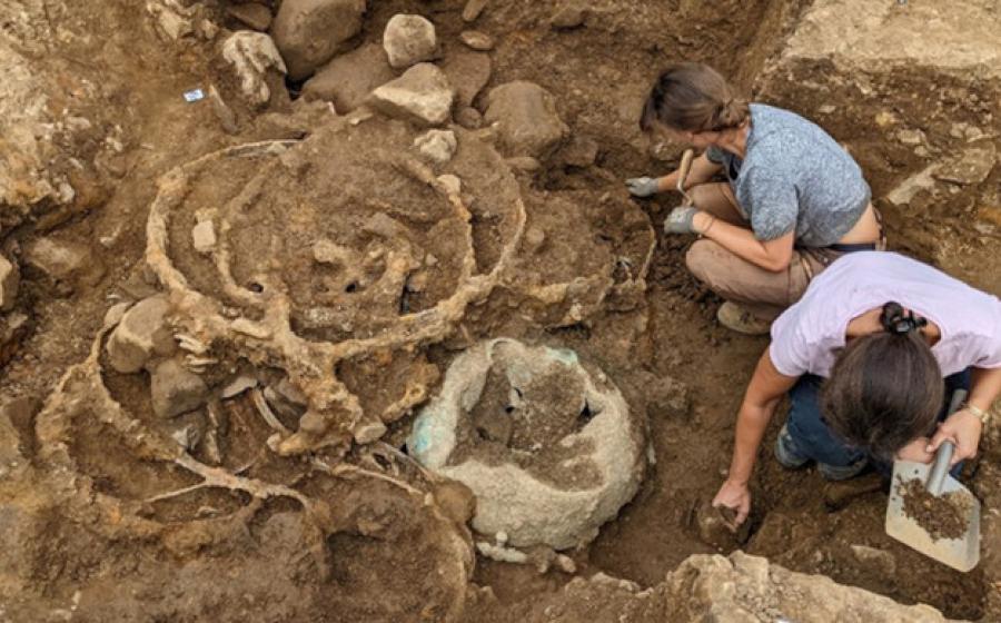 The deposit of iron tyres in Trench 1 shortly after being uncovered.