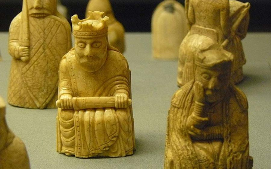 Lewis Chessmen king and queen, with rook and knight behind them.