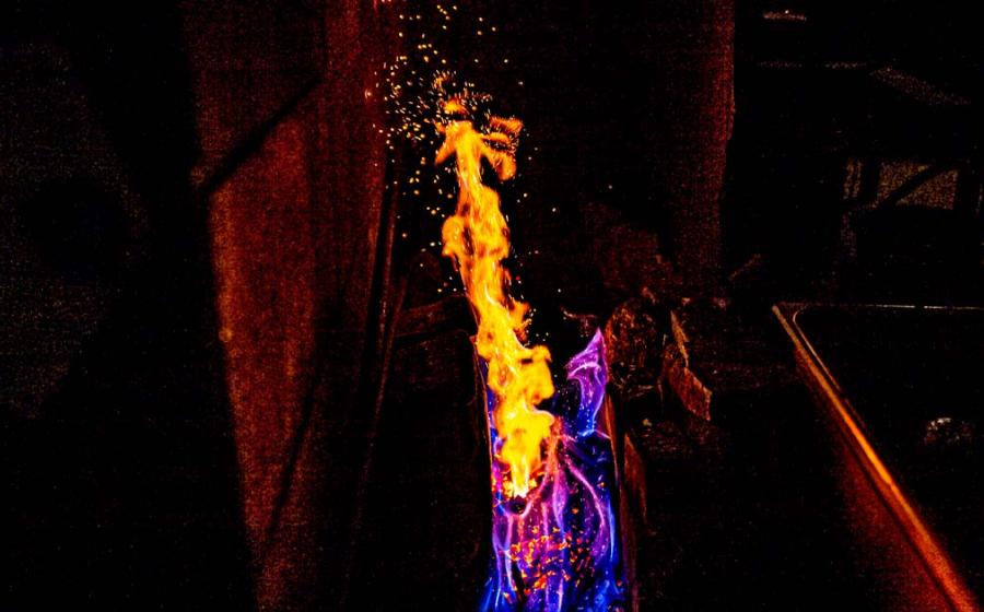 Fire and coal forging Japanese sword in a kiln of a blacksmith in Japan. Source: Karori Production / Adobe Stock.
