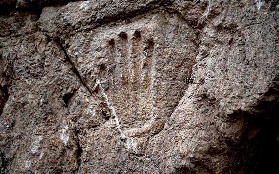 The mystery handprint was discovered on an ancient moat wall in the Old City of Jerusalem. Source: Yuli Schwartz / Israel Antiquities Authority
