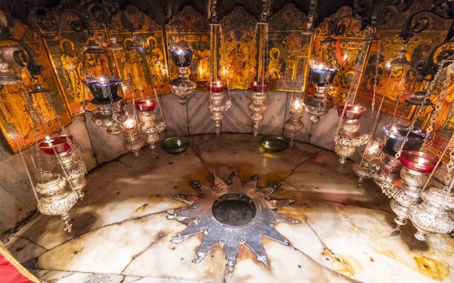 A silver star marks the traditional site Jesus' birthplace in a grotto underneath Bethlehem's Church of the Nativity.       