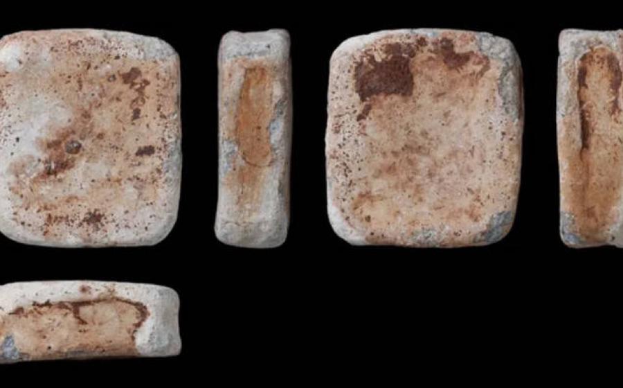 One of three lead ingots discovered with seven bronze items by a metal detectorist near Dereham, Norfolk