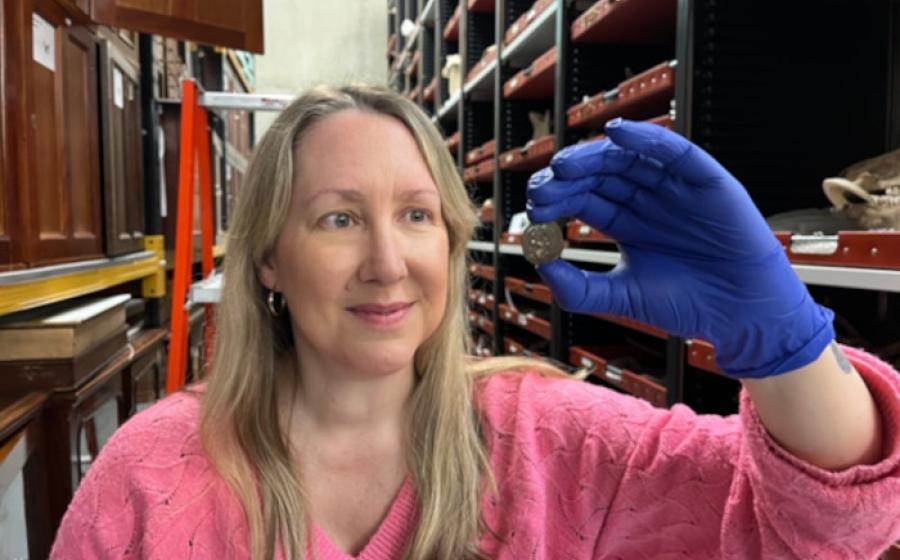 Kat Baxter, Leeds Museum and Galleries’ curator of archaeology and numismatics, shows the ancient coin.
